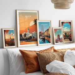 Agadir Travel Poster – Moroccan Mosque and Desert Sunset Art displayed among other travel posters.