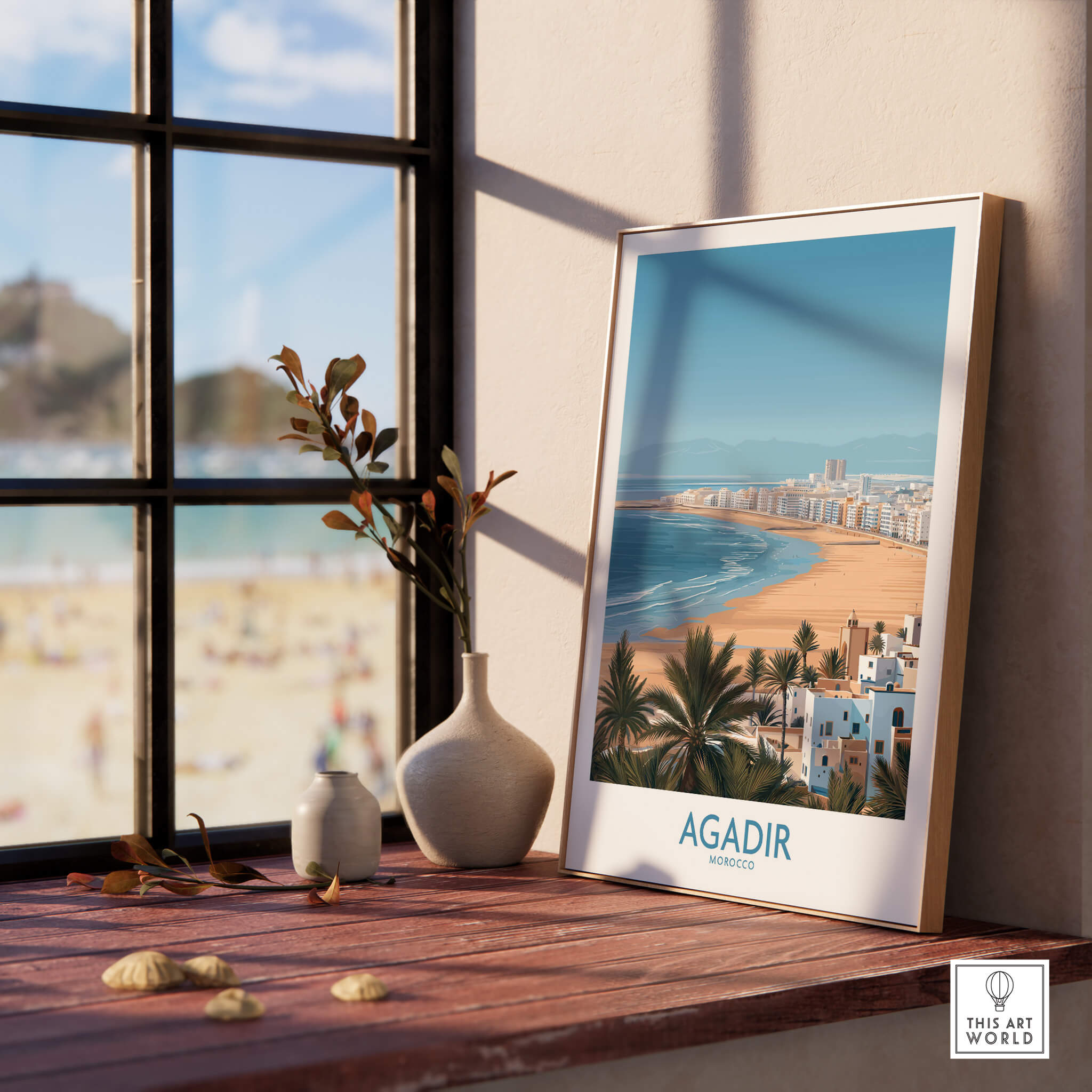 Agadir Morocco Print – Panoramic Beach and Palm Tree Wall Decor displayed on a wooden table with a view of the beach.