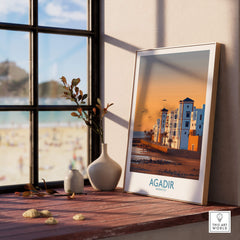 Agadir Morocco Wall Art showcasing a coastal scene with vibrant architecture and golden beach at sunset in a stylish interior.