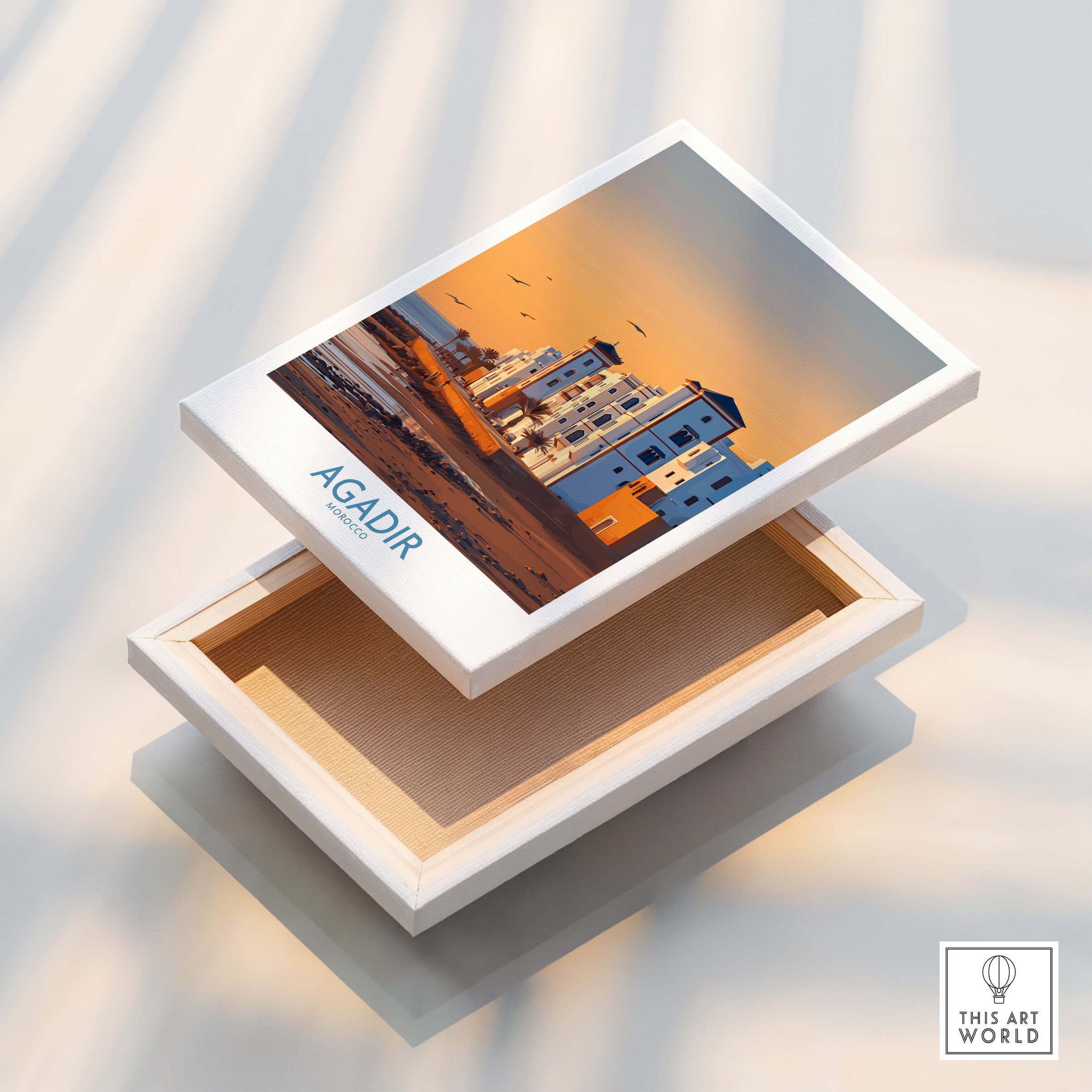 Agadir Morocco Wall Art featuring a vibrant print of coastal buildings at sunset in Agadir, Morocco.