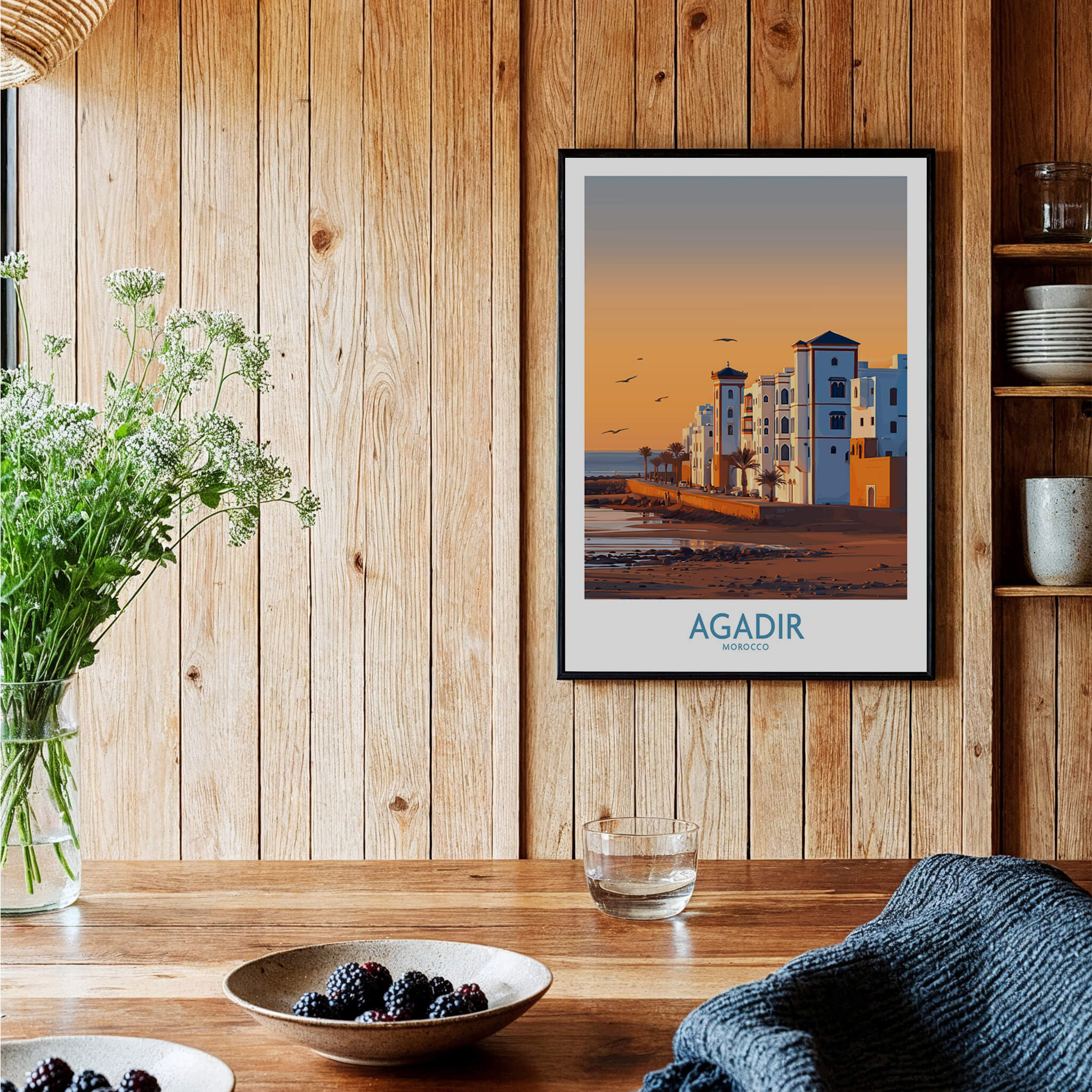 Agadir Morocco Wall Art showcasing coastal architecture and sunset hues in a cozy interior setting.