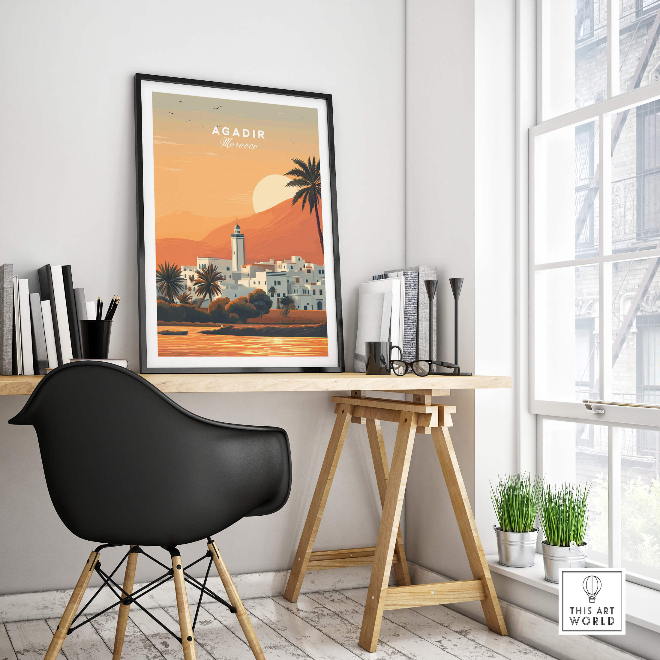 Agadir Travel Poster – Moroccan Mosque and Desert Sunset Art displayed in a stylish workspace with natural light.
