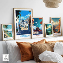 Alberobello Travel Poster displayed among other travel posters in a stylish home decor setting.