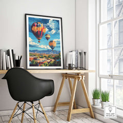 Albuquerque Print New Mexico framed on wall above desk with hot air balloons and vibrant landscape.