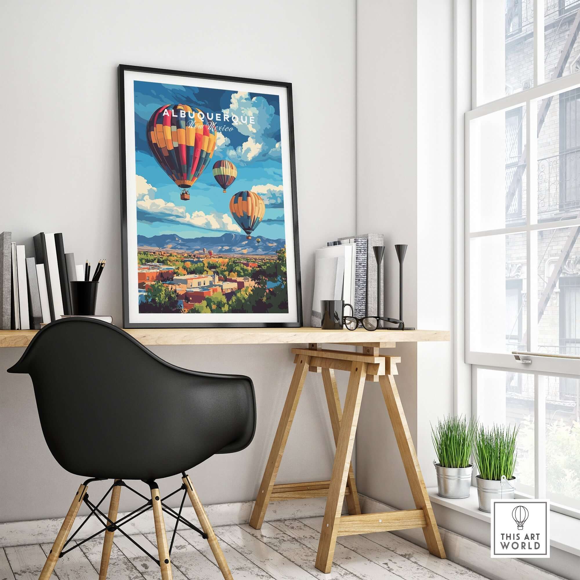 Albuquerque Print New Mexico framed on wall above desk with hot air balloons and vibrant landscape.