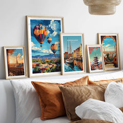 Albuquerque Print New Mexico among framed travel posters on a stylish bed.