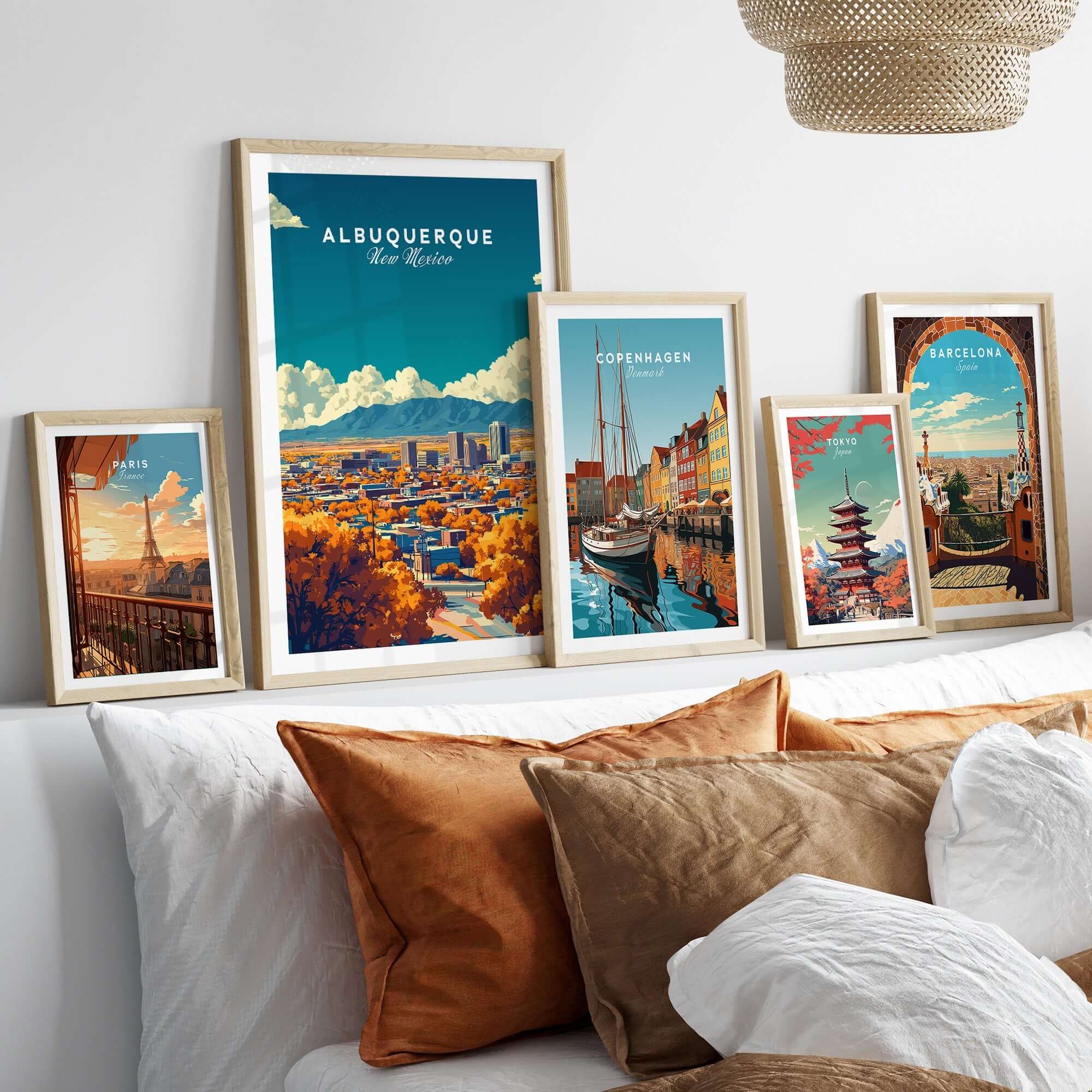Albuquerque Wall Art displayed in stylish frames on a cozy bed with decorative pillows.