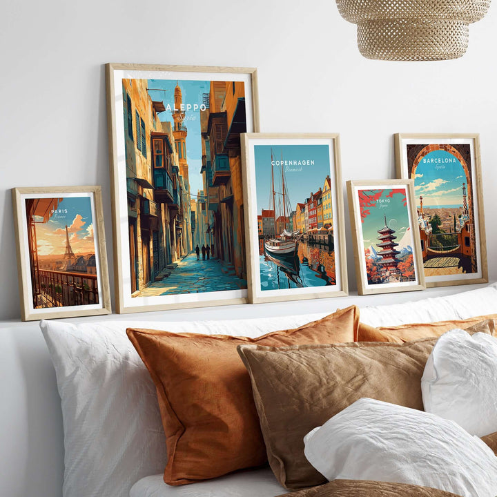Aleppo art print alongside travel posters of Copenhagen and Barcelona, displayed in a stylish living room setting.