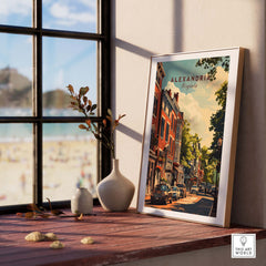 Framed Alexandria Virginia wall art showcasing vibrant city streets and historic architecture near a window.
