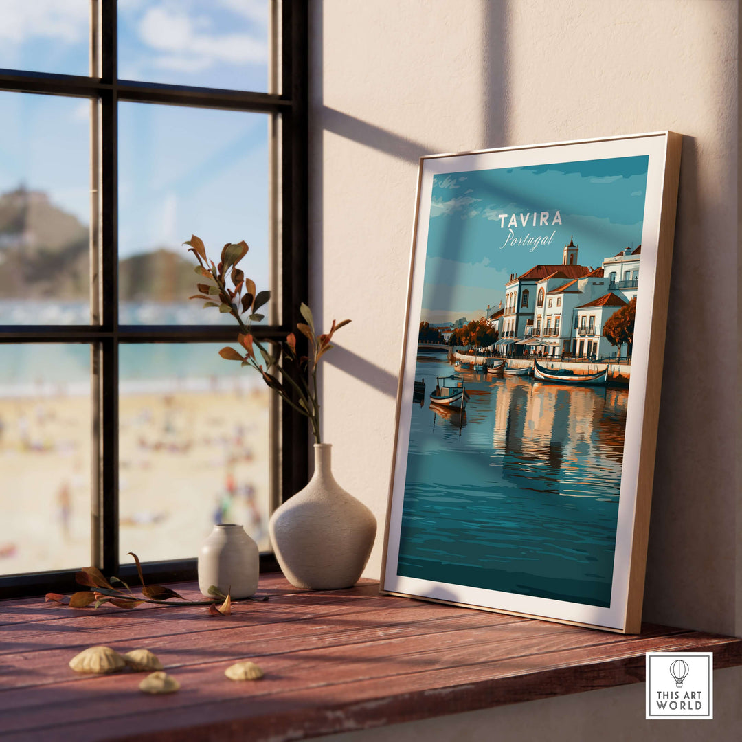 Framed Tavira, Portugal cityscape poster by the window with decor, showcasing the River Gilão and scenic architecture.