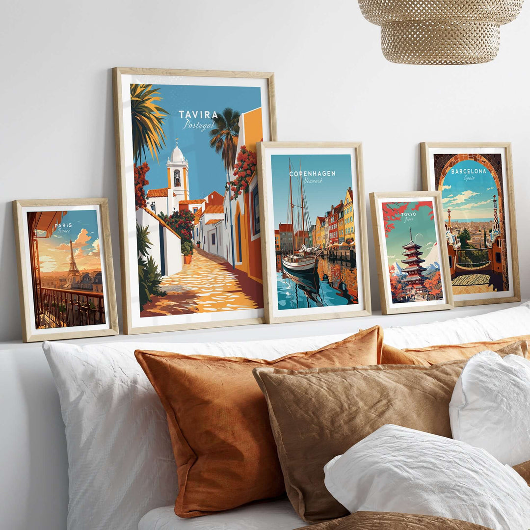 A cozy living room with framed Algarve Tavira wall decor posters showcasing vibrant travel destinations and warm colors.