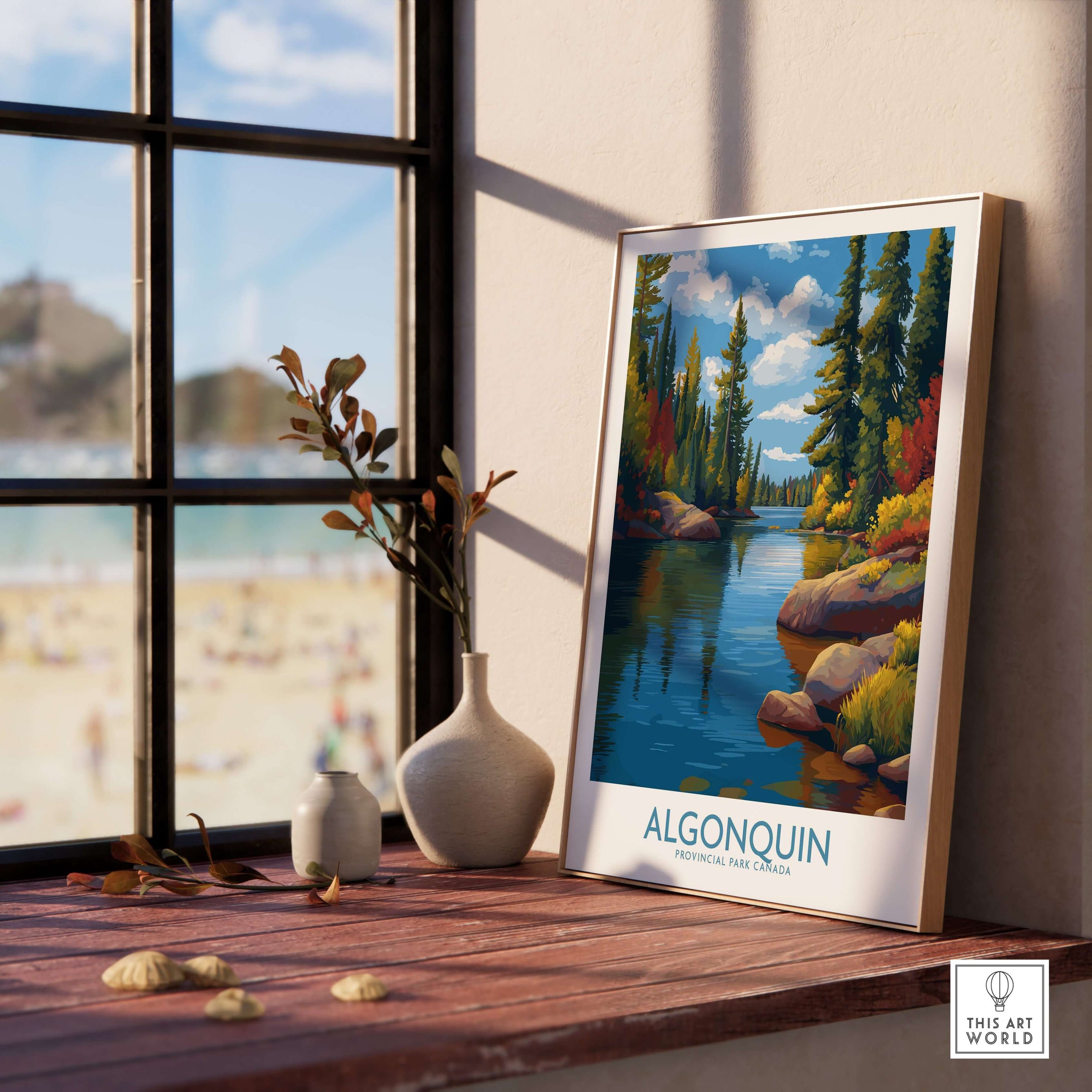 Algonquin Autumn Forest Art Print | Canada Fall Wilderness Poster displayed on a table near a window with a scenic view.