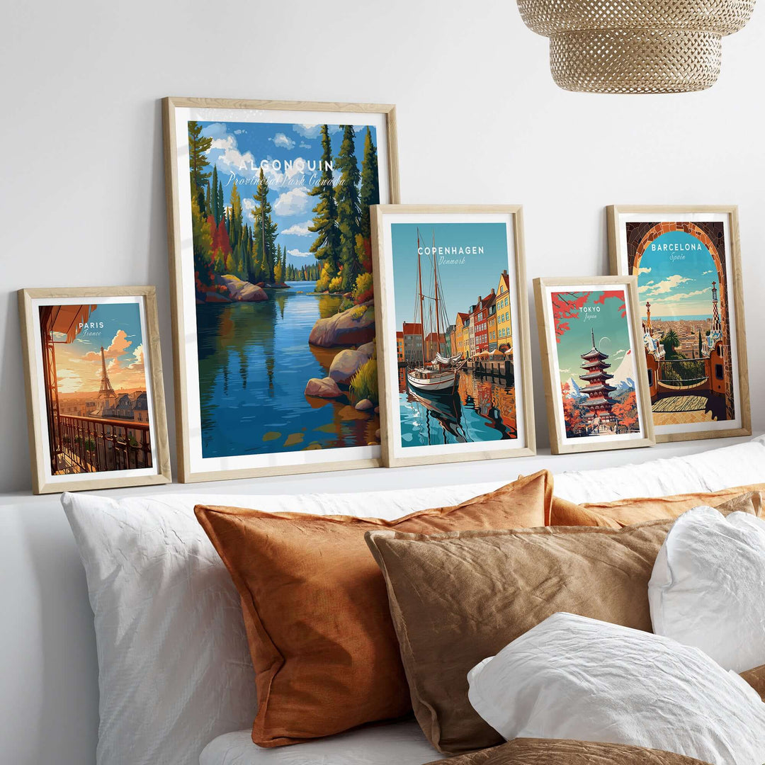Algonquin Ontario Vibrant Riverside Landscape Print | Nature Wall Art displayed among travel prints on a cozy sofa