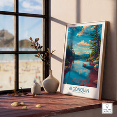 Algonquin Provincial Park Lake Canoe Art Print | Canada Wilderness Poster displayed on a wooden shelf by a sunny window.