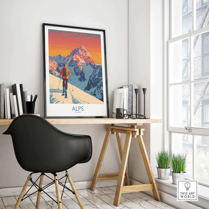 Alps Poster France on desk in modern room, vibrant snowy mountain scene, perfect for ski enthusiasts and adventure lovers.