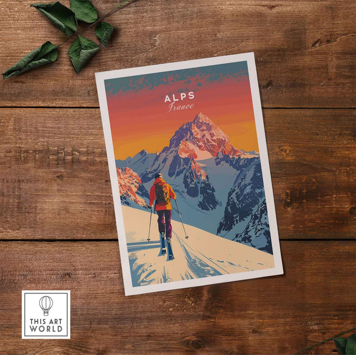 Alps Print France ski poster on wooden table, featuring colorful mountain scene with skier, ideal for travel and decor enthusiasts.