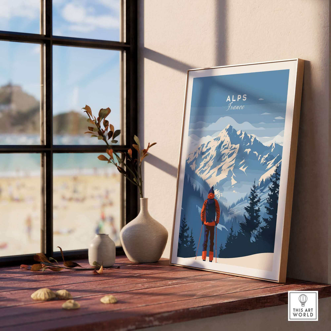 Alps travel poster featuring stunning mountain peaks and a hiker, displayed in a cozy interior with a beach view.