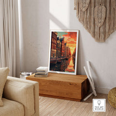 Amsterdam Sunset Canal Wall Art Print featuring vibrant colors and iconic canals in a cozy living room setting.