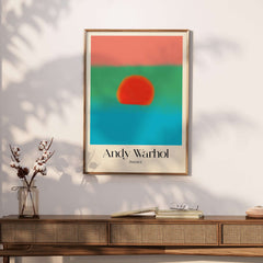 Andy Warhol Sunset Coral Green Blue Pop Art Poster Abstract Wall Art Print Modern displayed on a wall above a wooden console.