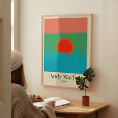 Andy Warhol Sunset Coral Green Blue Pop Art Poster Abstract Wall Art Print Modern on display in a cozy interior setting.