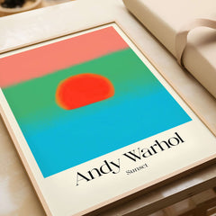 Andy Warhol Sunset Coral Green Blue Pop Art Poster Abstract Wall Art Print Modern displayed on a table.