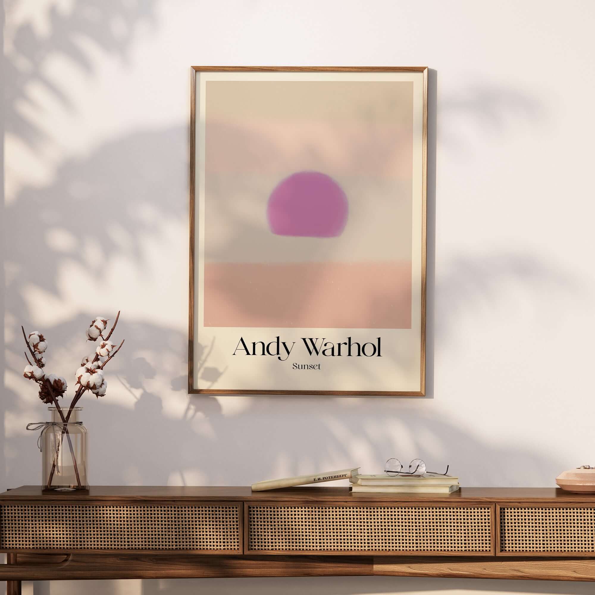 Andy Warhol Sunset Pastel Pink Purple Pop Art Print Subtle Abstract Poster Wall Art displayed on a wooden console.