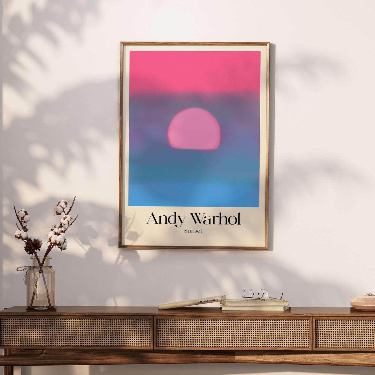 Andy Warhol Sunset Pink Blue Pop Art Poster Abstract Screenprint Wall Art Print displayed on a stylish wooden table.