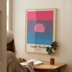 Andy Warhol Sunset Pink Blue Pop Art Poster Abstract Screenprint Wall Art Print displayed above a cozy reading nook.