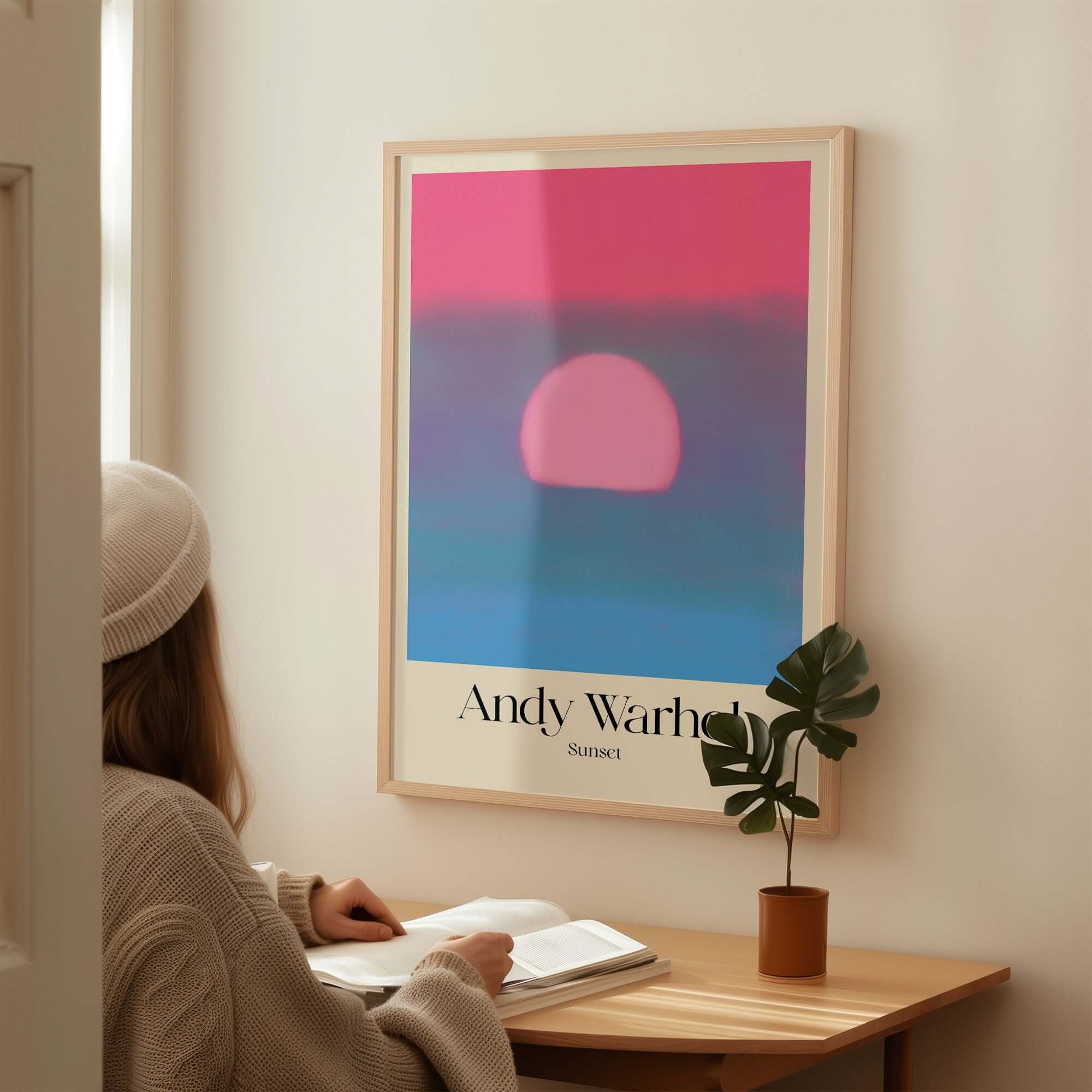 Andy Warhol Sunset Pink Blue Pop Art Poster Abstract Screenprint Wall Art Print displayed above a cozy reading nook.
