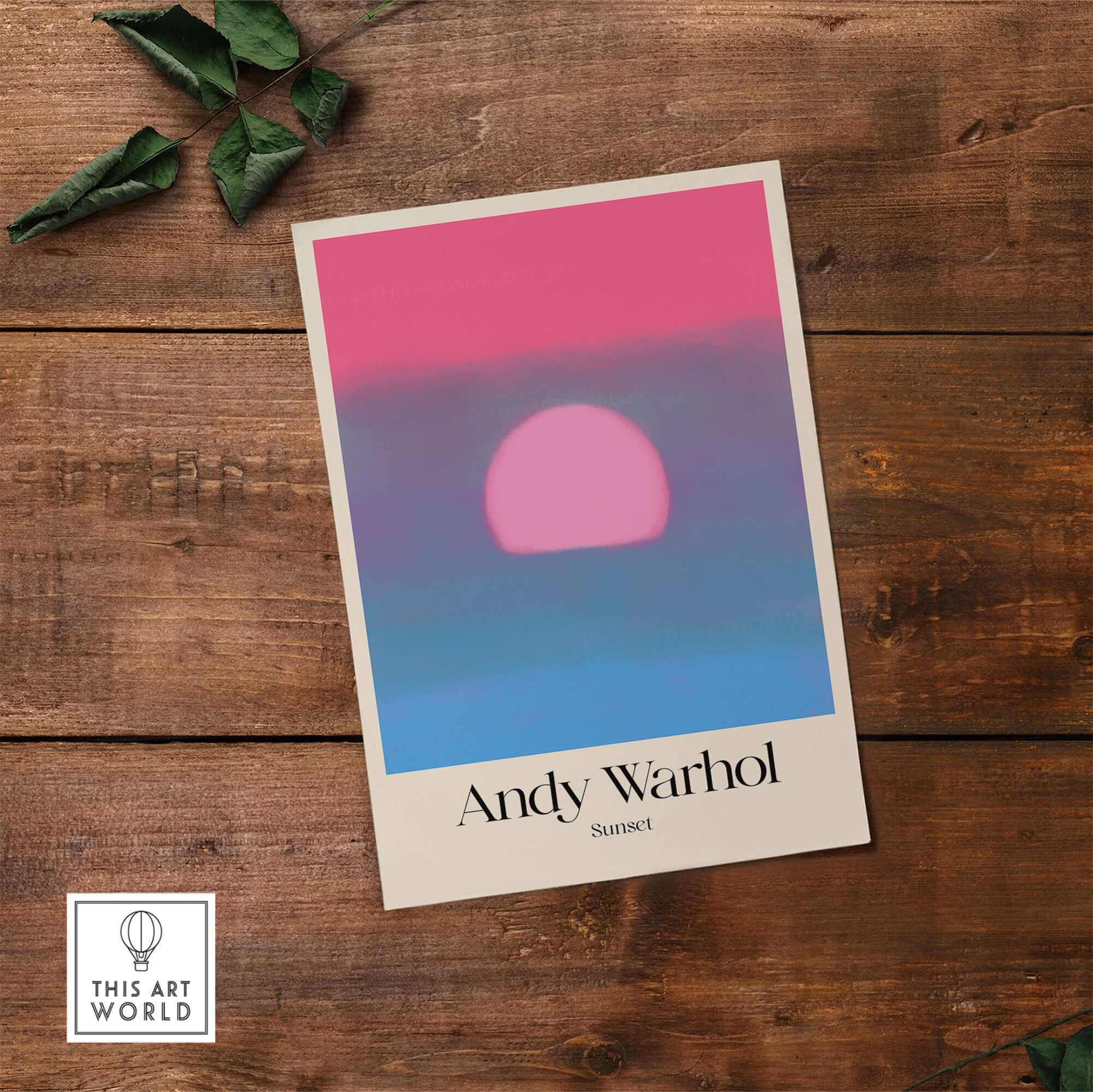 Andy Warhol Sunset Pink Blue Pop Art Poster Abstract Screenprint Wall Art Print displayed on wooden table.
