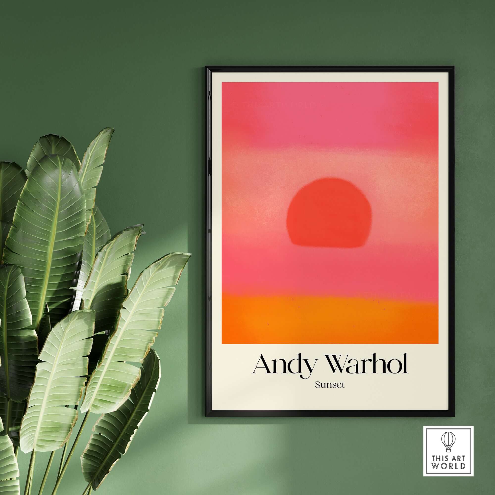 Andy Warhol Sunset Pink Orange Pop Art Print Modern Abstract Poster Wall Art in a stylish frame on a green wall.