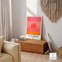 Andy Warhol Sunset Pink Orange Pop Art Print Modern Abstract Poster Wall Art displayed in a stylish living room setting.