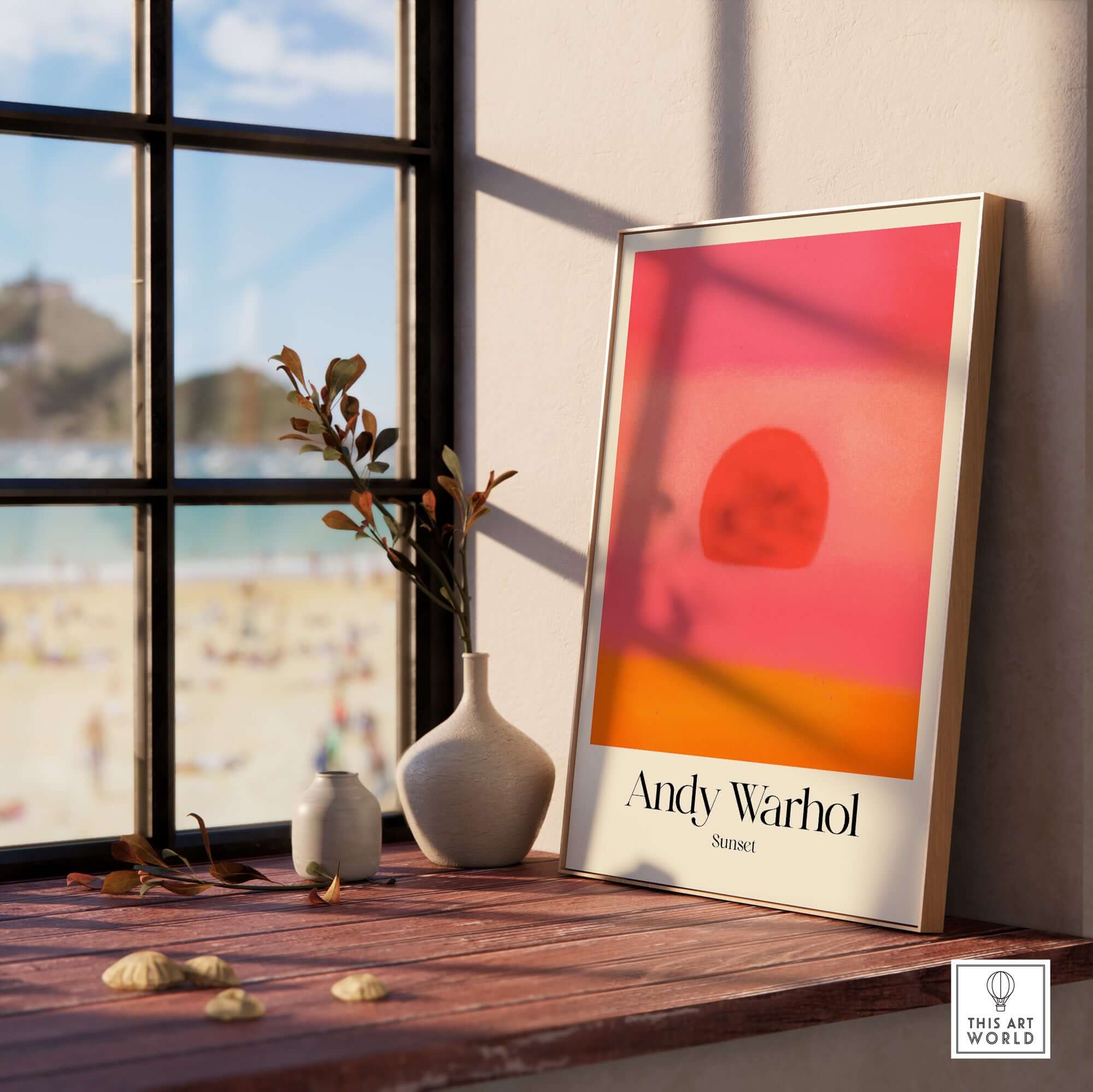 Andy Warhol Sunset Pink Orange Pop Art Print Modern Abstract Poster Wall Art displayed in a sunlit room with beach view.