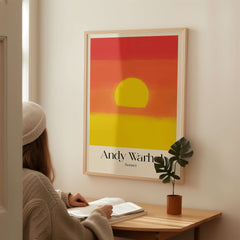 Andy Warhol Sunset Red Yellow Pop Art Abstract Print Modern Landscape Poster displayed in a cozy interior setting.