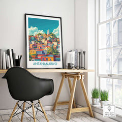 Antananarivo Travel Poster hanging in a stylish office with a modern desk and chair, showcasing vibrant cityscape art.