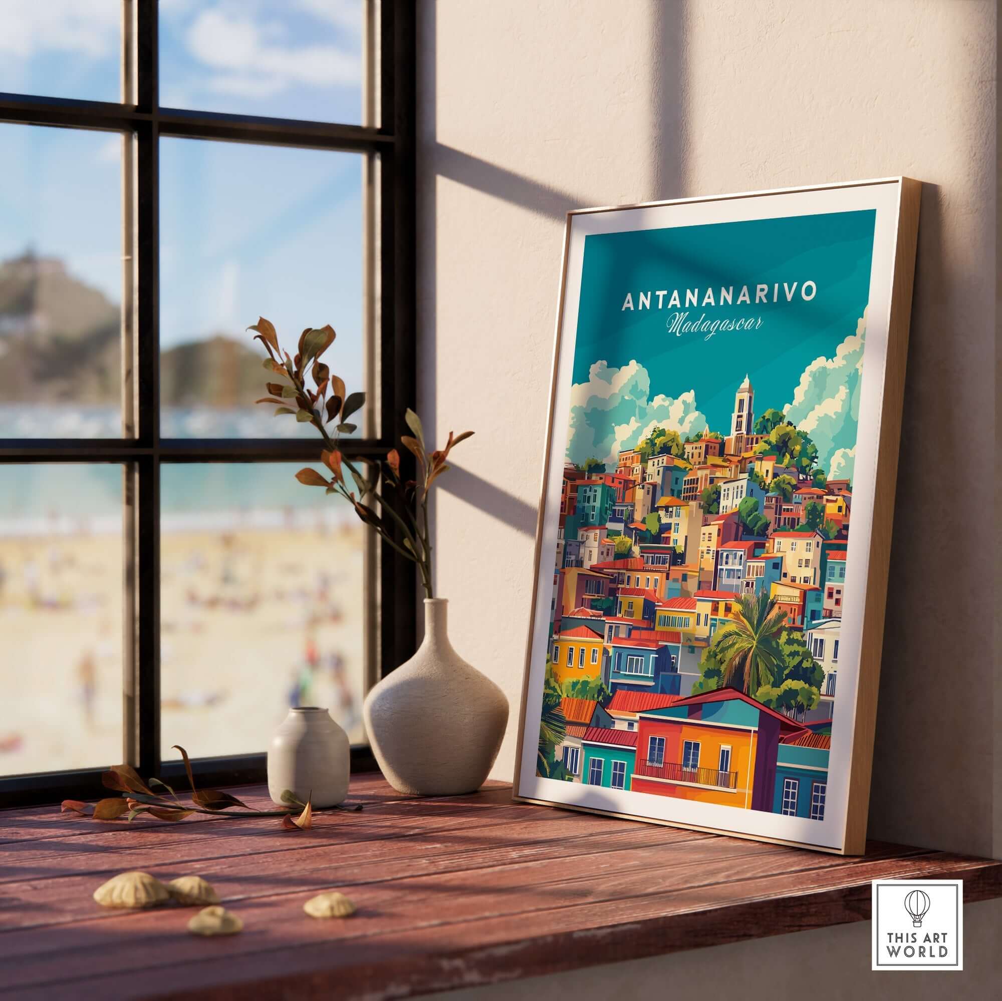 Antananarivo Travel Print displayed on a windowsill, showcasing the vibrant colors of Madagascar's capital.