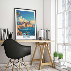 Antibes Art Print displayed in a stylish workspace, featuring a vibrant coastal scene of Antibes in France.