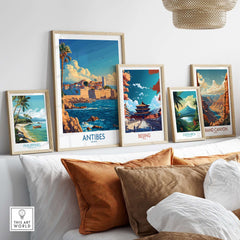 Antibes Art Print displayed among other travel posters on a stylish shelf, enhancing interior decor.