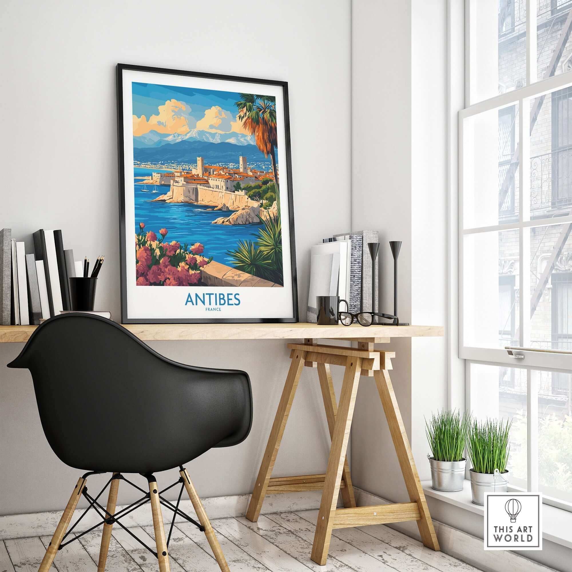 Antibes Travel Poster displayed in a stylish workspace, capturing the beauty of the French Riviera.
