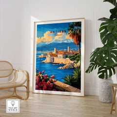 Antibes Travel Print showcasing a vibrant coastal scene of Antibes with palm trees and mountains in the background.