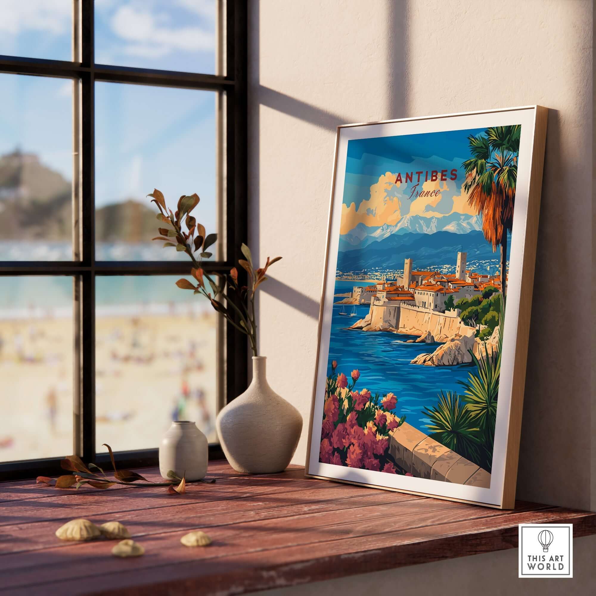 Antibes Travel Print displayed in a cozy setting, showcasing the beauty of the French Riviera.
