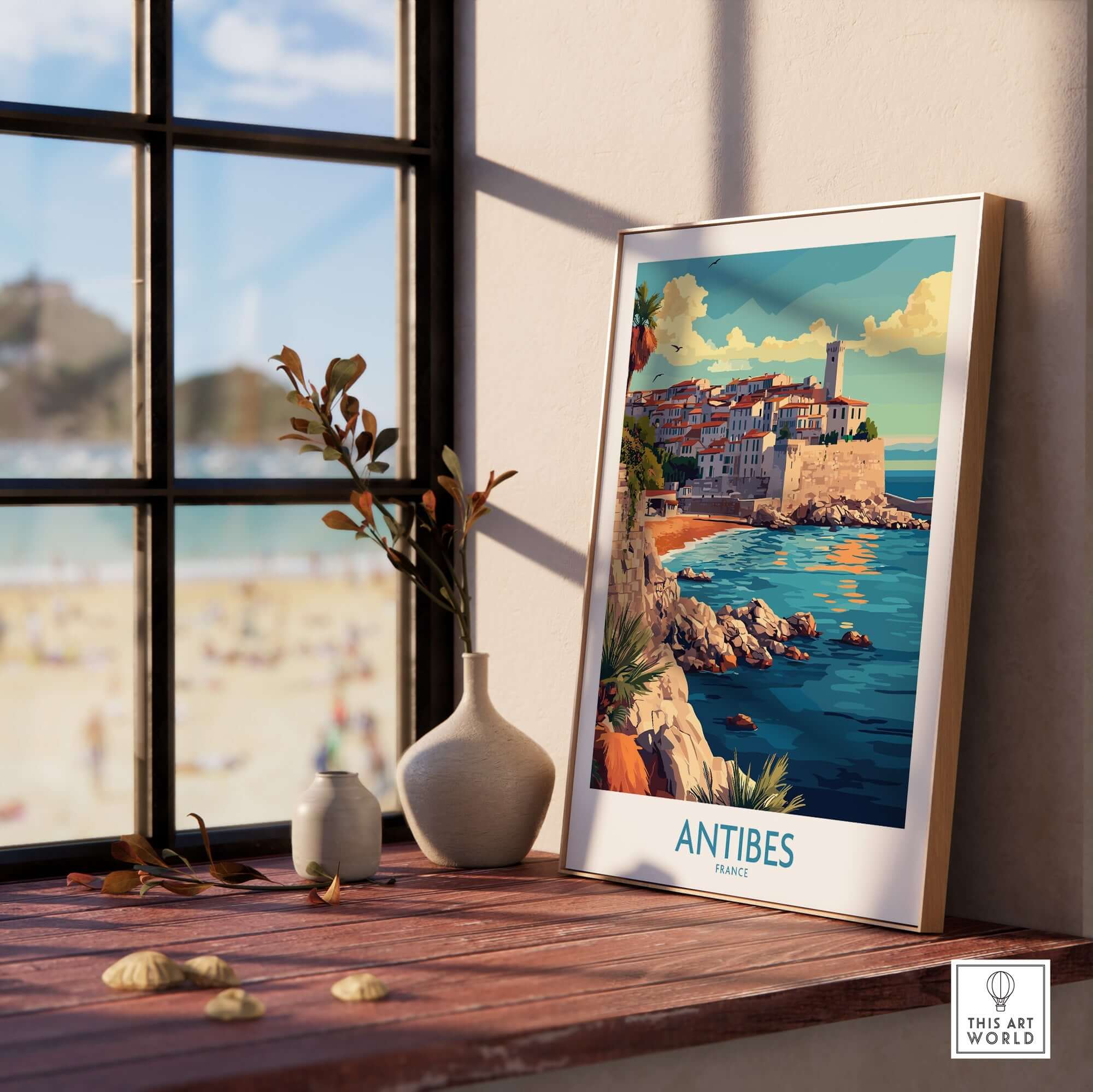Antibes Wall Art Print featuring a coastal view of Antibes, France, elegantly displayed by a window.