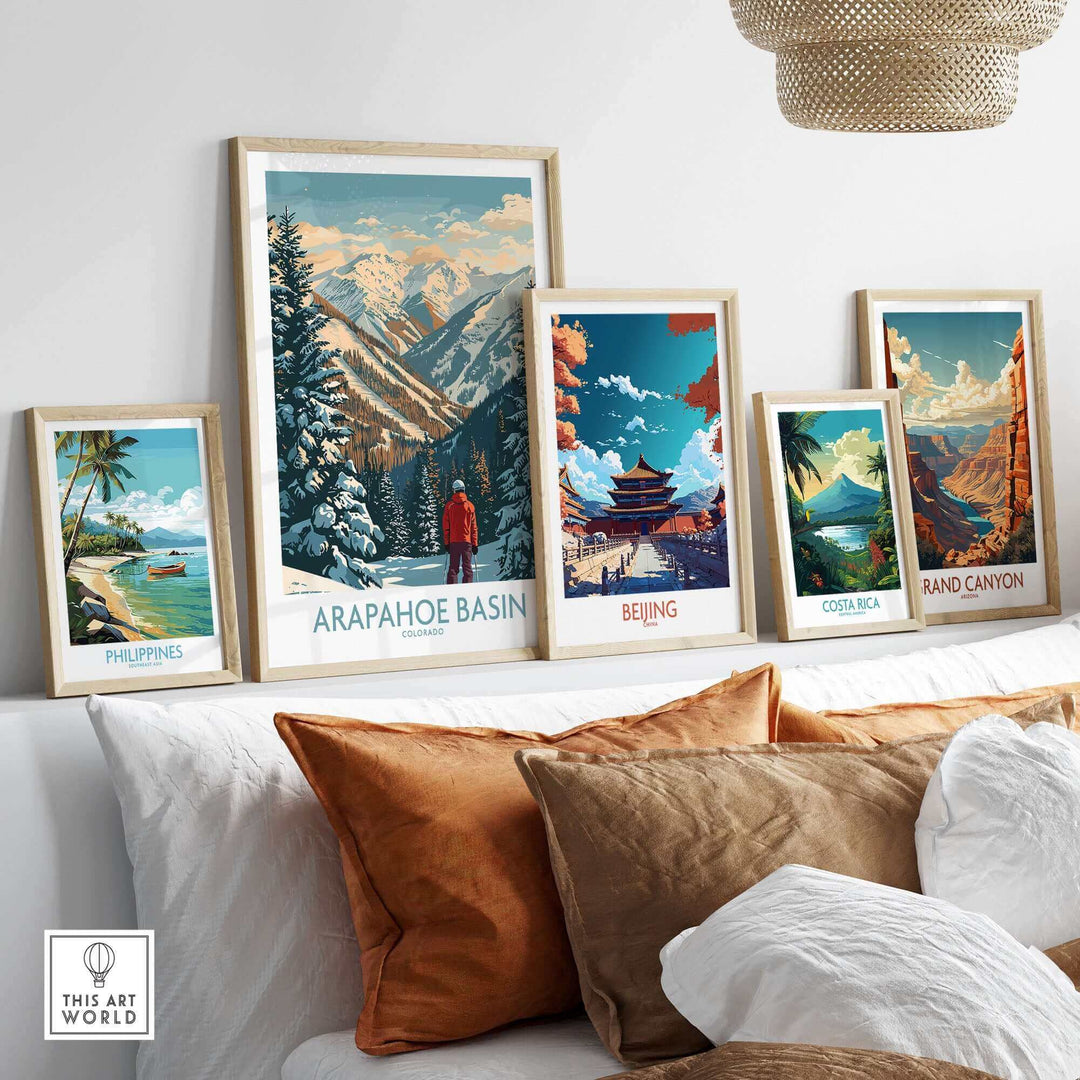 Arapahoe Basin Ski Poster displayed with travel-themed artwork on a modern white shelf.