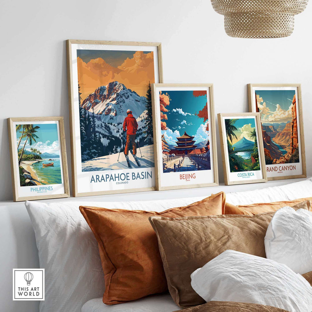 Arapahoe Basin ski print displayed among framed travel posters on a wall, showcasing Colorado's mountainous landscape.