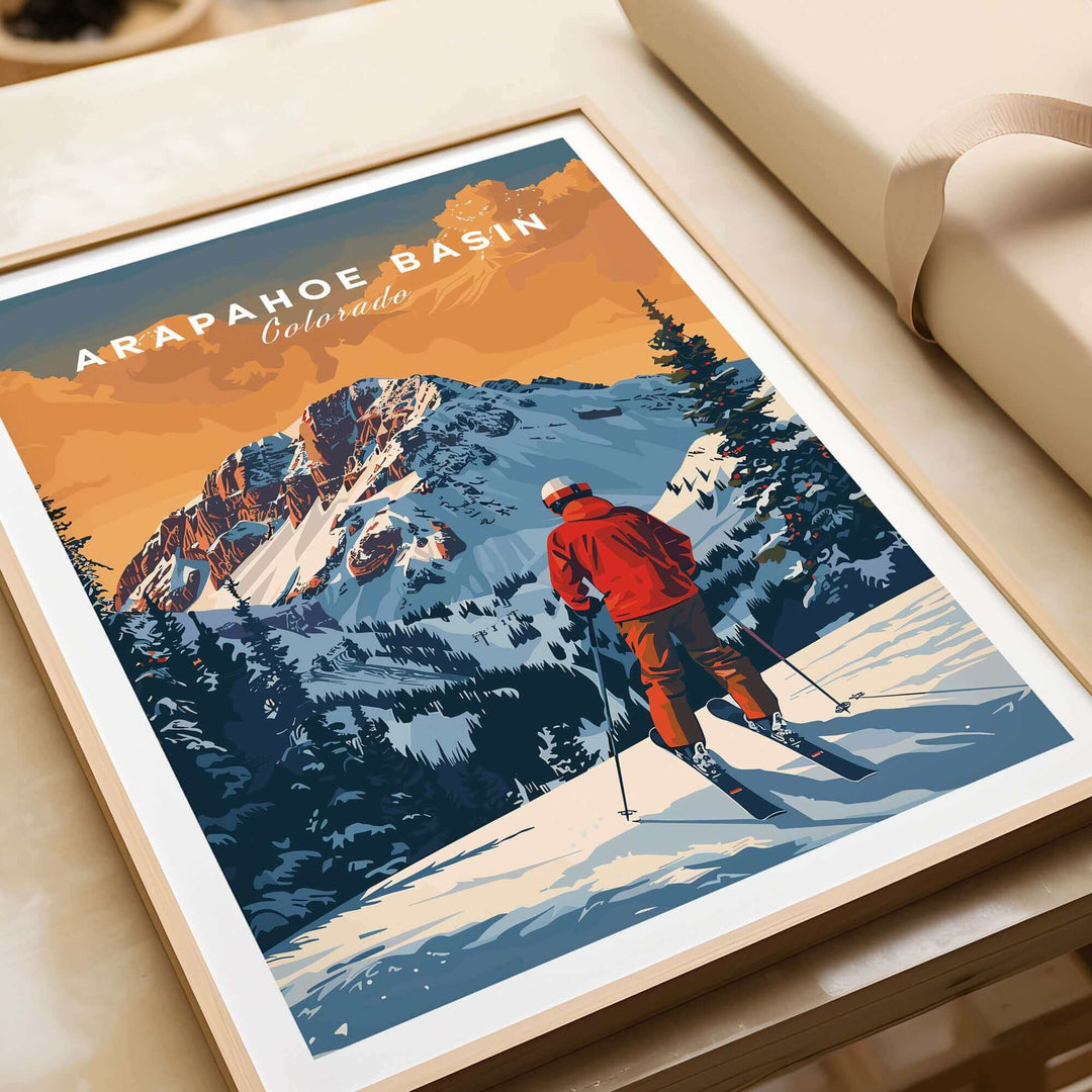 Arapahoe Basin travel poster featuring a skier against stunning Colorado mountains and sunset backdrop. Perfect for decor.