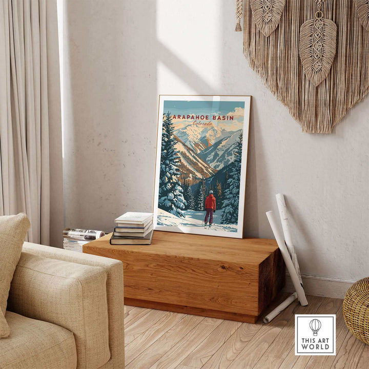 Arapahoe Basin wall art poster in cozy living room setting, featuring mountain scenery and skier, perfect for outdoor enthusiasts.