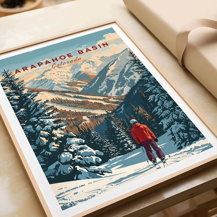 Arapahoe Basin wall art featuring skier in snowy landscape with mountains and trees, perfect for outdoor enthusiasts and art lovers.