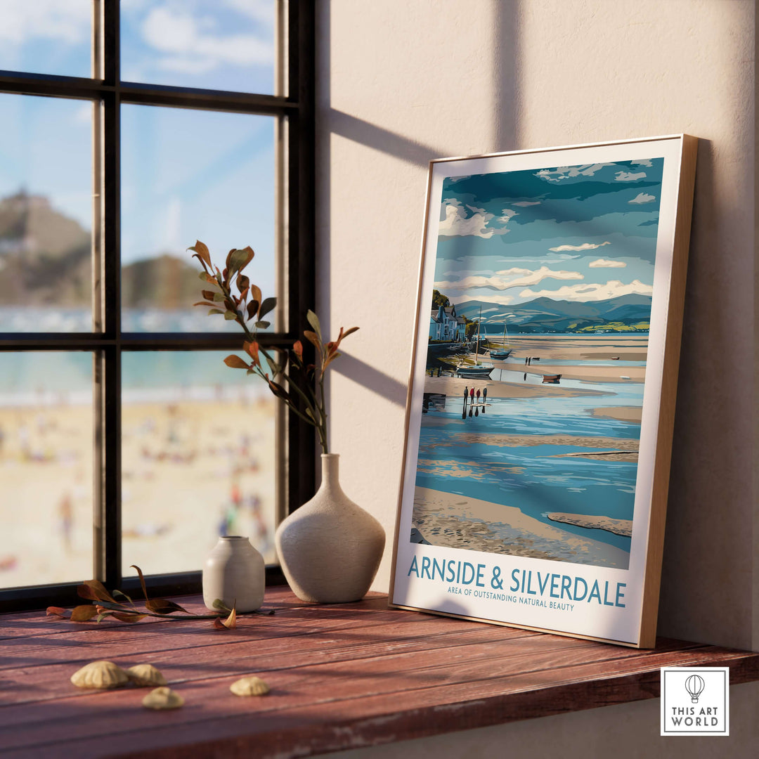 Framed Arnside and Silverdale AONB wall art print beside a vase, showcasing stunning landscapes and serene beach scenery.