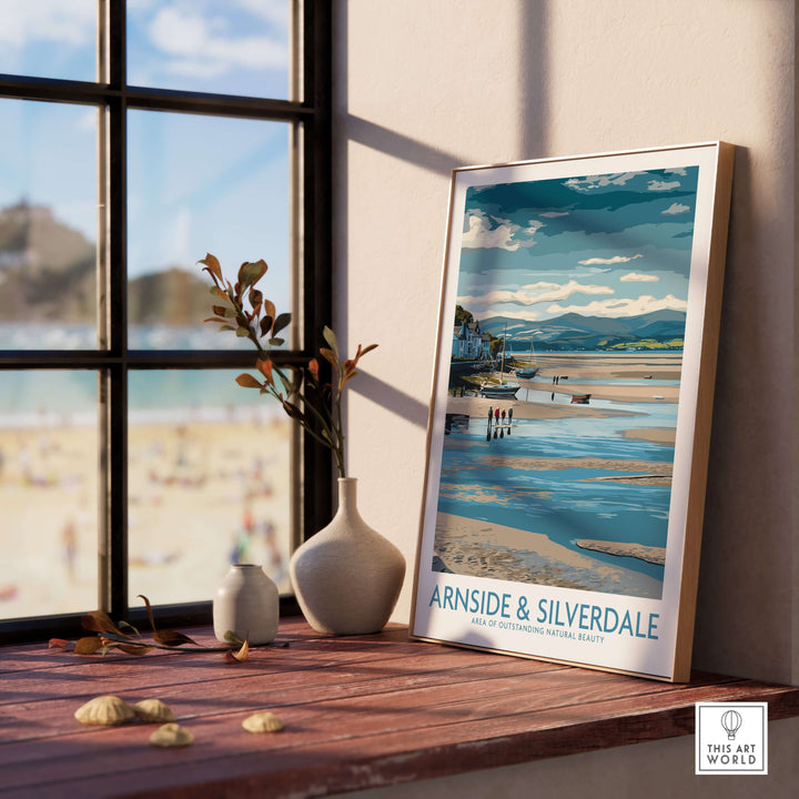 Framed Arnside and Silverdale AONB wall art print beside a vase, showcasing stunning landscapes and serene beach scenery.