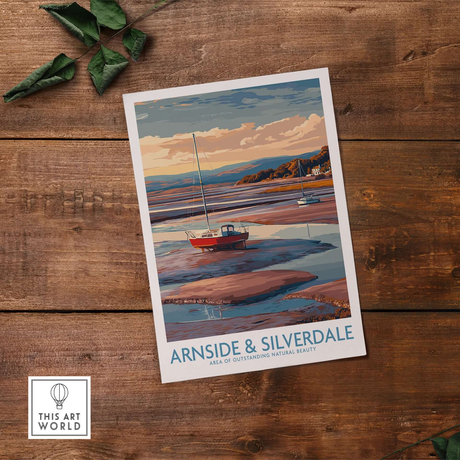 Arnside and Silverdale AONB Travel Poster featuring a boat and stunning natural scenery on a wooden table.